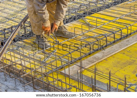 Builder worker Installing Steel Work Before Concrete Pour