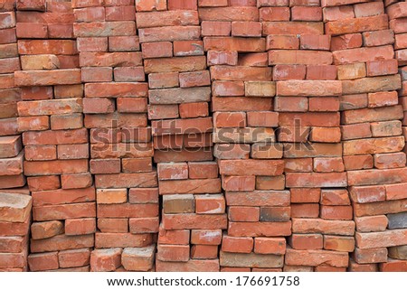 Large pile of red bricks background, pile of old red bricks