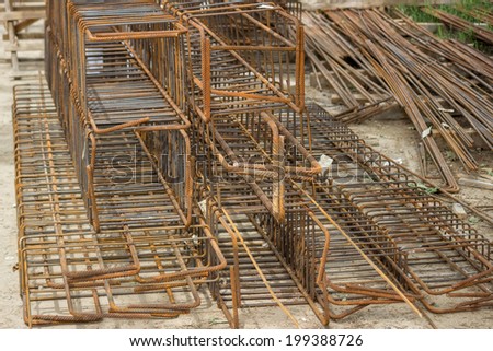 Tied rebar beam cages for cast concrete to increase tensile strength. Selective focus.