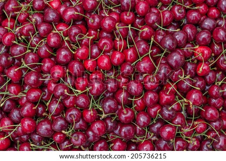 Farmers market cherry background. At the farmers market local growers come and sell their freshly picked crops at reasonable prices.
