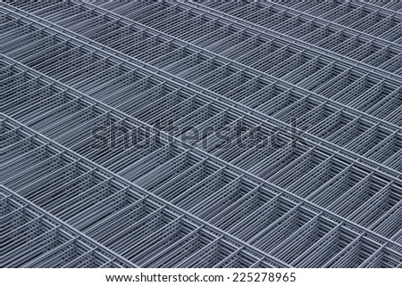 Wire mesh panels, metal net protective fence net background. Galvanized wire and PVC coated wire panels. Selective focus.