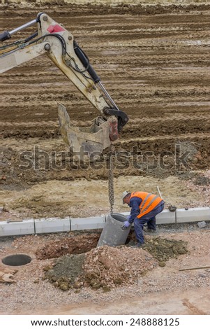 BELGRADE, SERBIA - JANUARY 17: Workers installing storm drain system to reduce flooding during storms. At construction site in January 2015.