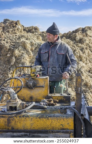 BELGRADE, SERBIA - FEBRUARY 16: Operator on concrete pump truck for placing concrete into formwork. At construction site in February 2015.