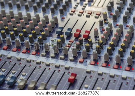 Controls of sound mixer control panel, mixer audio buttons. Selective focus and shallow dof.
