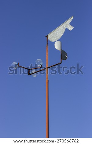 Vintage wind vane to observe and measure wind speed and direction.