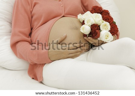 Pregnancy is the carrying of flowers given to her before going to work