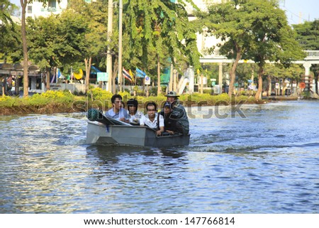 BANGKOK, THAILAND - OCTOBER 16: Huge flood disaster in Thailand. As a result, unidentified people have to be evacuated from their houses - October 16, 2011 in Bangkok, Thailand