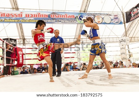 AYUTTHAYA, THAILAND- MARCH 17 : Women Thai boxing match between  Yordying SithMuaySiam (Thai) VS Little Tiger (Japan) at World Muay Thai Fight Fastival on March 17, 2013 in Ayutthaya, Thailand.