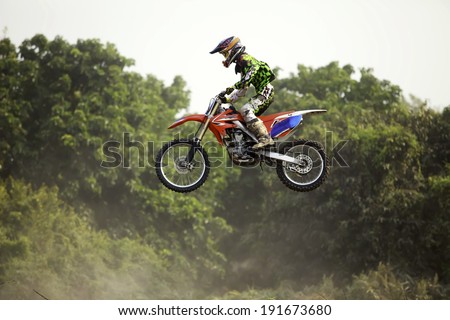 Biker biker making a stunt driver.