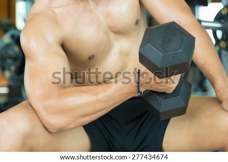 People are lifting weights for arm exercises.