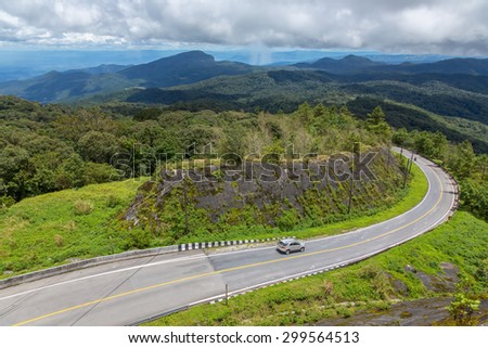 The road curves up Doi Inthanon.