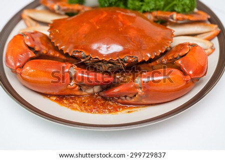 chili crab dish on a white background.