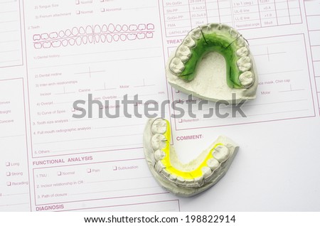 Dental retainers on chart, braces