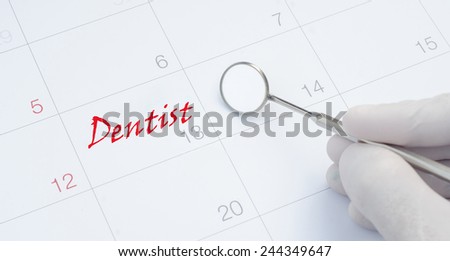 A note of a dentist appointment on a calendar, dental check up
