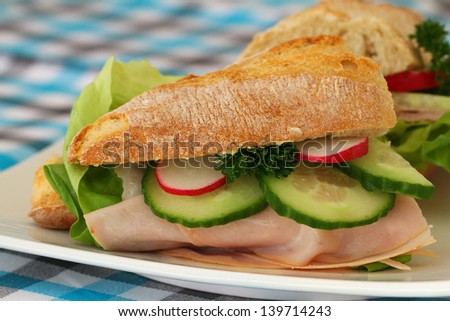 Ham, radish and cucumber sandwich, close up