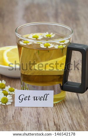 Get well card, chamomile tea and fresh lemon