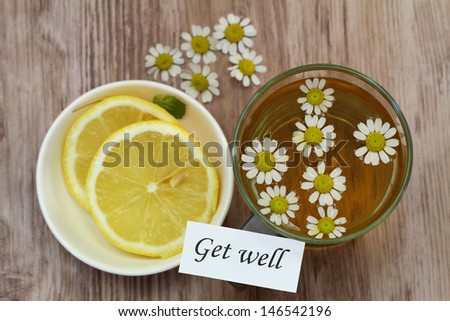 Get well card, chamomile tea and fresh lemon