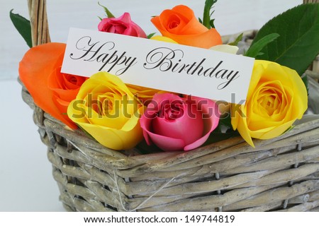 Happy Birthday card with colorful roses in wicker basket