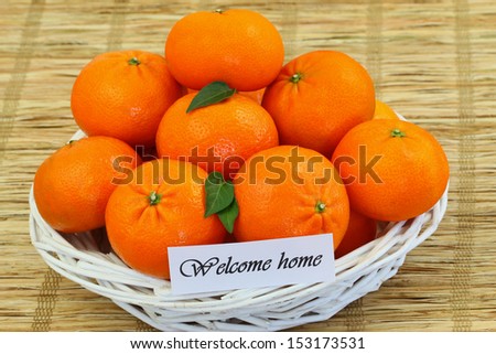 Welcome home card with basket full of mandarines