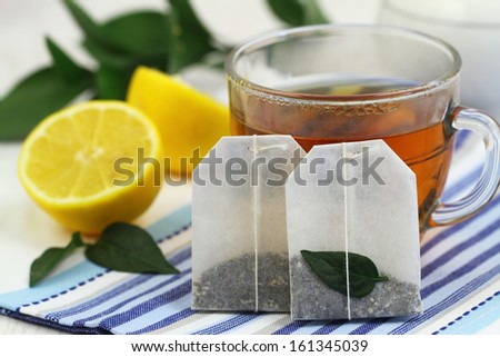 Tea bags, tea and fresh lemon