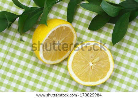 Lemon halves on green checkered cloth