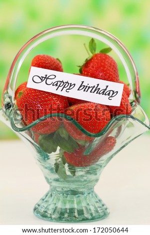Happy birthday card with fresh strawberries in vintage glass basket