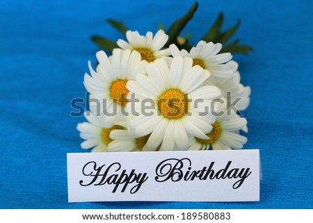 Happy Birthday card with white daisies on blue background