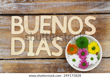 Buenos Dias (Good morning in Spanish) written with wooden letters, and Santini flowers