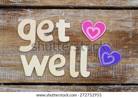 Get well written with wooden letters on rustic wooden surface