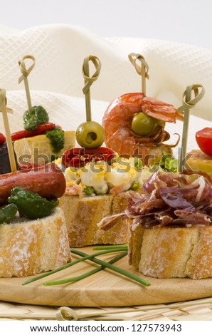 Spanish cuisine. Montaditos. Sliced bread topped with a variety of appetizers. Spanish Tapas.