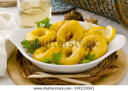 Spanish cuisine. Tapas. Fried Squid Rings in a white plate. Selective Focus. Calamares a la Romana.