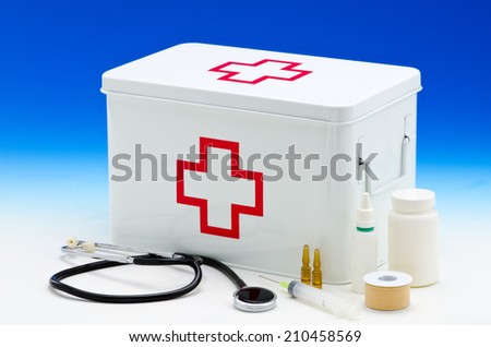 First aid box and medical supplies in blue background