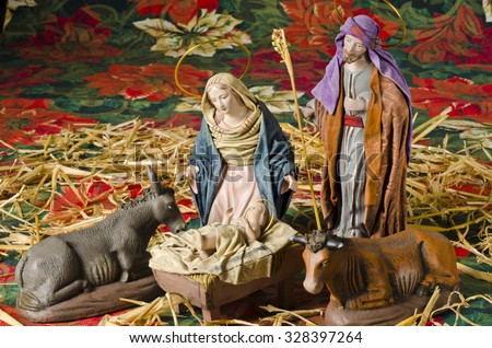 Christmas Crib. Figures of Baby Jesus, Virgin Mary and St. Joseph