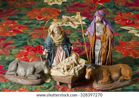 Christmas Crib. Figures of Baby Jesus, Virgin Mary and St. Joseph