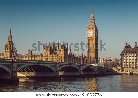 Retro Photo Effect - Elizabeth Tower, Big Ben and Westminster Bridge in early morning light, London, England, UK