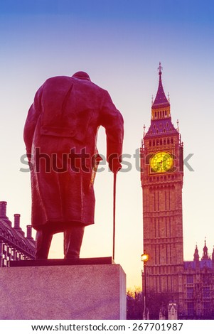 Retro Photo Effect - Statue of Sir Winston Churchill, looking towards Westminster Palace, Houses of Parliament, Elizabeth Tower, Big Ben, at Sunrise. London, England, UK.