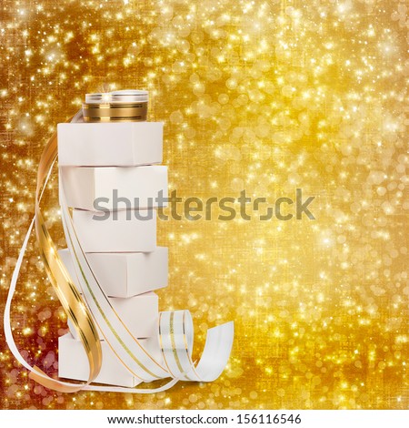 White boxes with gifts with gold ribbon beautiful abstract background