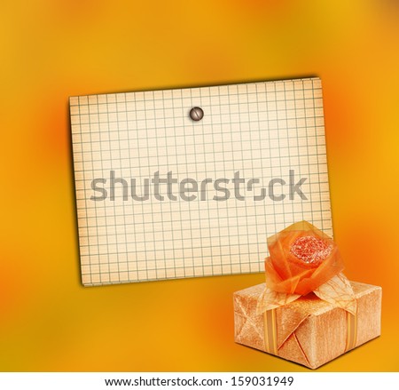 Old sheet of paper with gift box on grunge abstract background