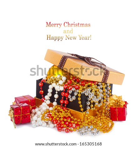 Golden gift box with Christmas balls and garlands of beautiful beads isolated on white background