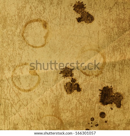 Rusty metal sheet with spots of coffee or tea