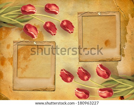 Bouquet of red tulips with green leaves on abstract paper background