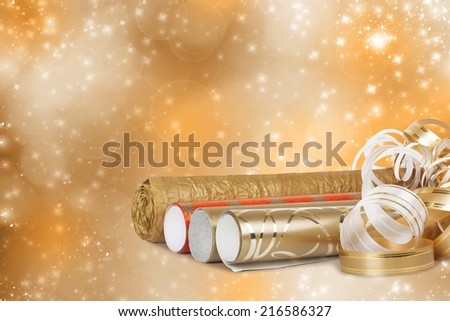 Rolls of multicolored wrapping paper for gifts with a streamer on a beautiful bright background