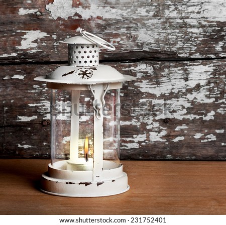 Old Christmas lantern on background of  old brick wall and floor