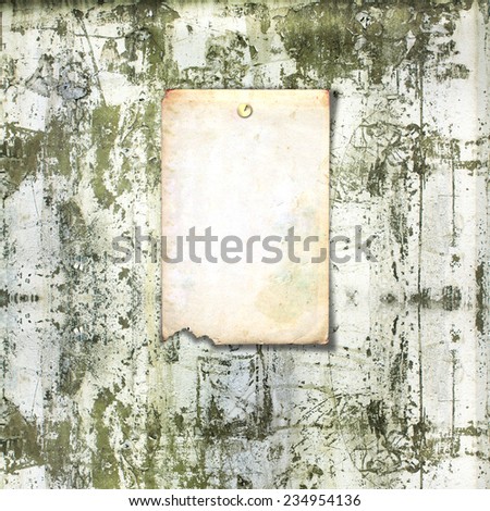 Old paper ad on shabby brick wall background