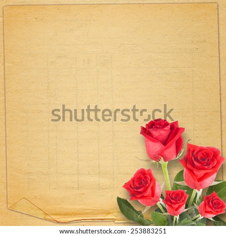 Old vintage card with a beautiful red rose on paper backgroundOld vintage card with a beautiful red rose on paper background