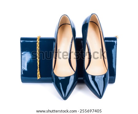 Beautiful blue shoes with clutches on white isolated background