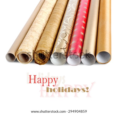 Rolls of colored wrapping paper with streamer for gifts isolated on white background