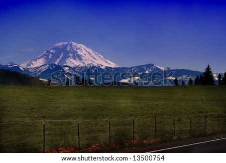 Mt. Rainier Meadow Background v1 is a beautiful scenic capture of Mt. Rainier in the vicinity of Buckley or Sumner Washington.