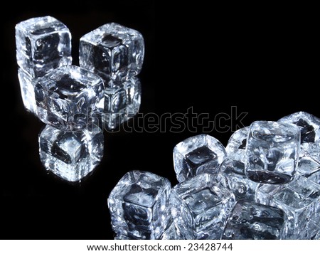 Ice cubes in a pool of water isolated on a black background