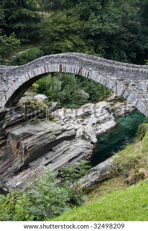 Ancient arch stone bridge in Verzasca valley, Switzerland
